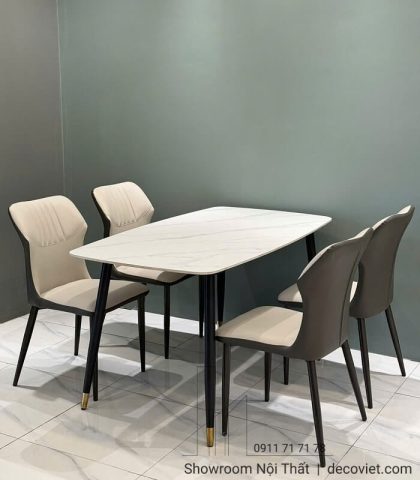 Bàn ăn 4 ghế mặt đá trắng hiện đại, ghế bọc da xám sang trọng, phù hợp căn hộ nhỏ gọn