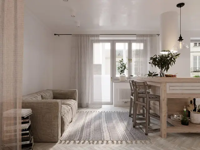 Một chiếc gương thủ công tô điểm cho khu vực phía trên một đơn vị vanity bê tông trắng.
