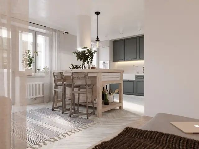 Một chiếc gương thủ công tô điểm cho khu vực phía trên một đơn vị vanity bê tông trắng.