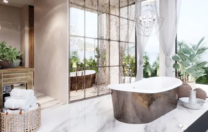 Một chiếc gương thủ công tô điểm cho khu vực phía trên một đơn vị vanity bê tông trắng.