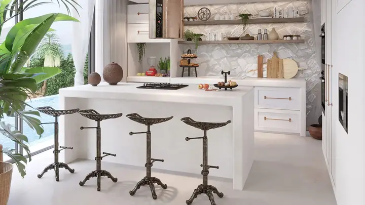 Một chiếc gương thủ công tô điểm cho khu vực phía trên một đơn vị vanity bê tông trắng.