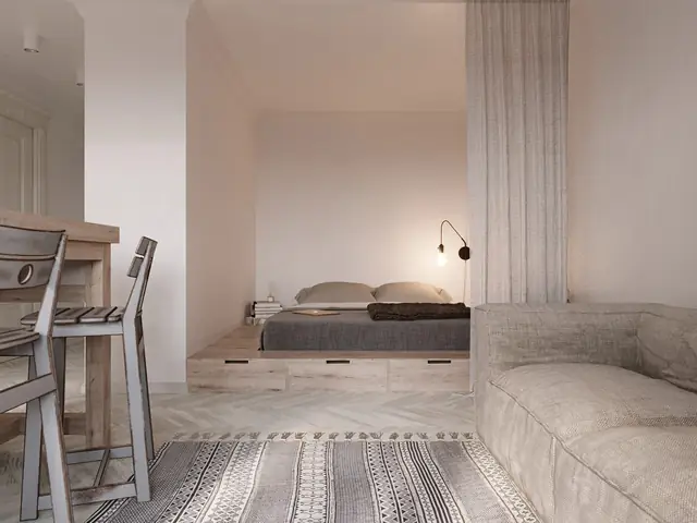 Một chiếc gương thủ công tô điểm cho khu vực phía trên một đơn vị vanity bê tông trắng.